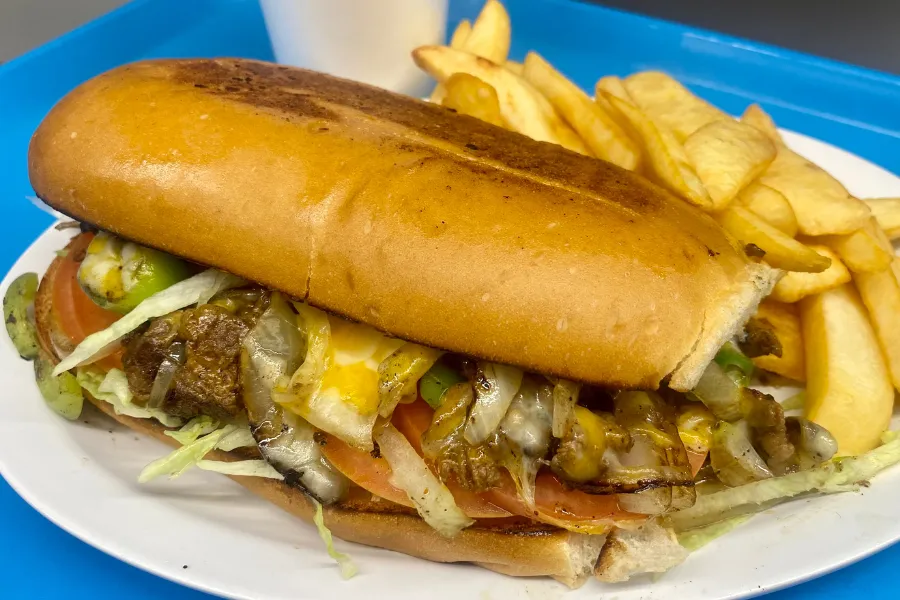 Pico Pica Rico | Philly Cheesesteak Meal - Very Popular - Steak, Topped with Sautéed Green Peppers, Mushrooms & Onions, Cheese, Lettuce, Tomato, Crispy Pickles & Mayo. Served with Steak Fries & Fountain Drink | Sherman Oaks 